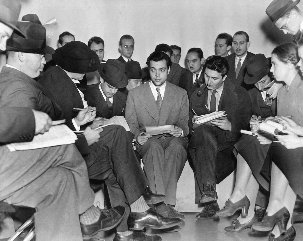 Orson Welles with the press