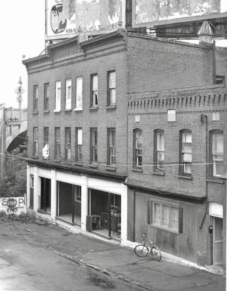 Barr Block in later years with concrete Court Street Bridge in backdrop